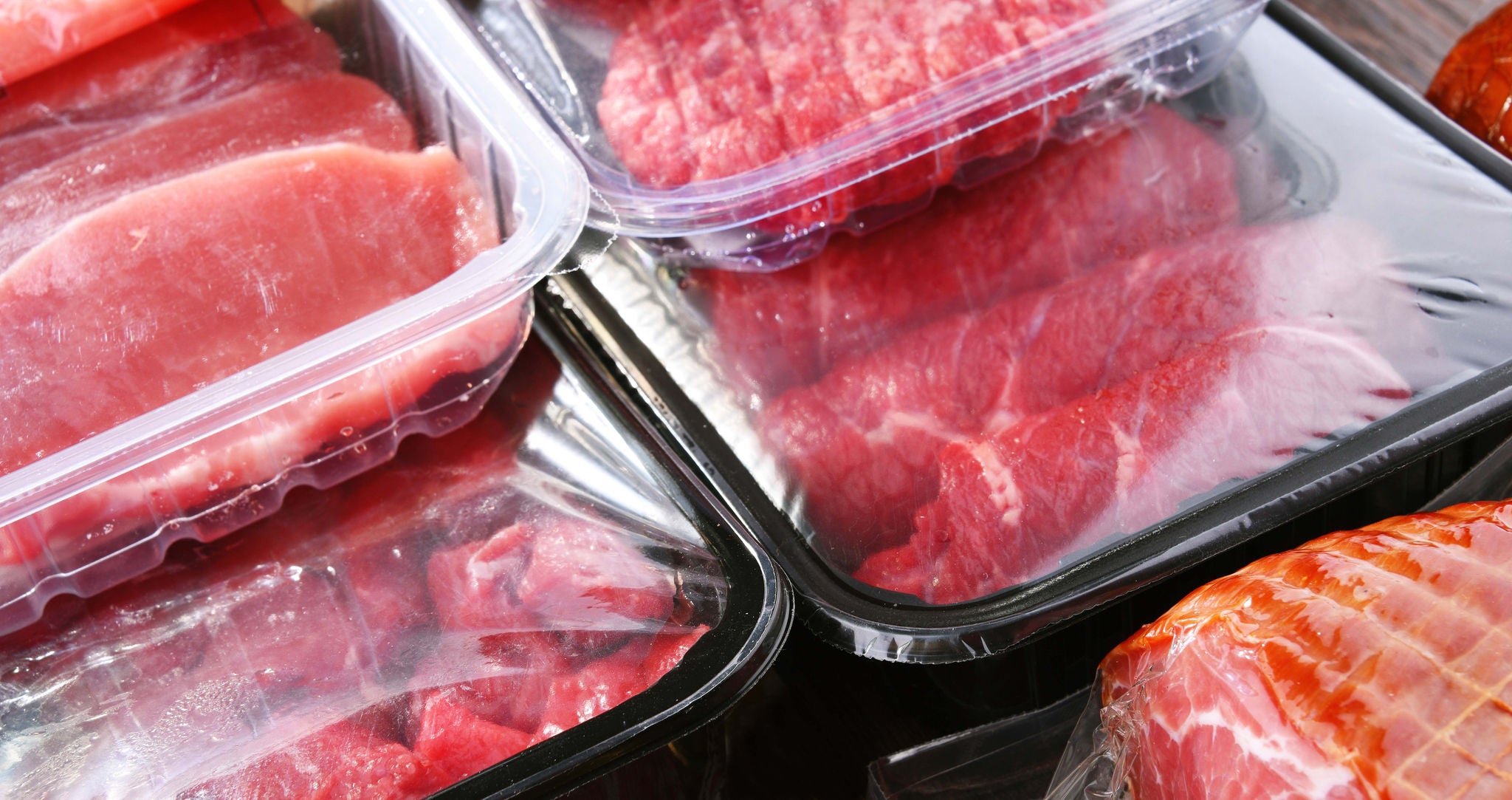 Composition with packages of assorted meat products; Shutterstock ID 2114989715; purchase_order: MUDE; job: ; client: Cornelia Geiger; other: 