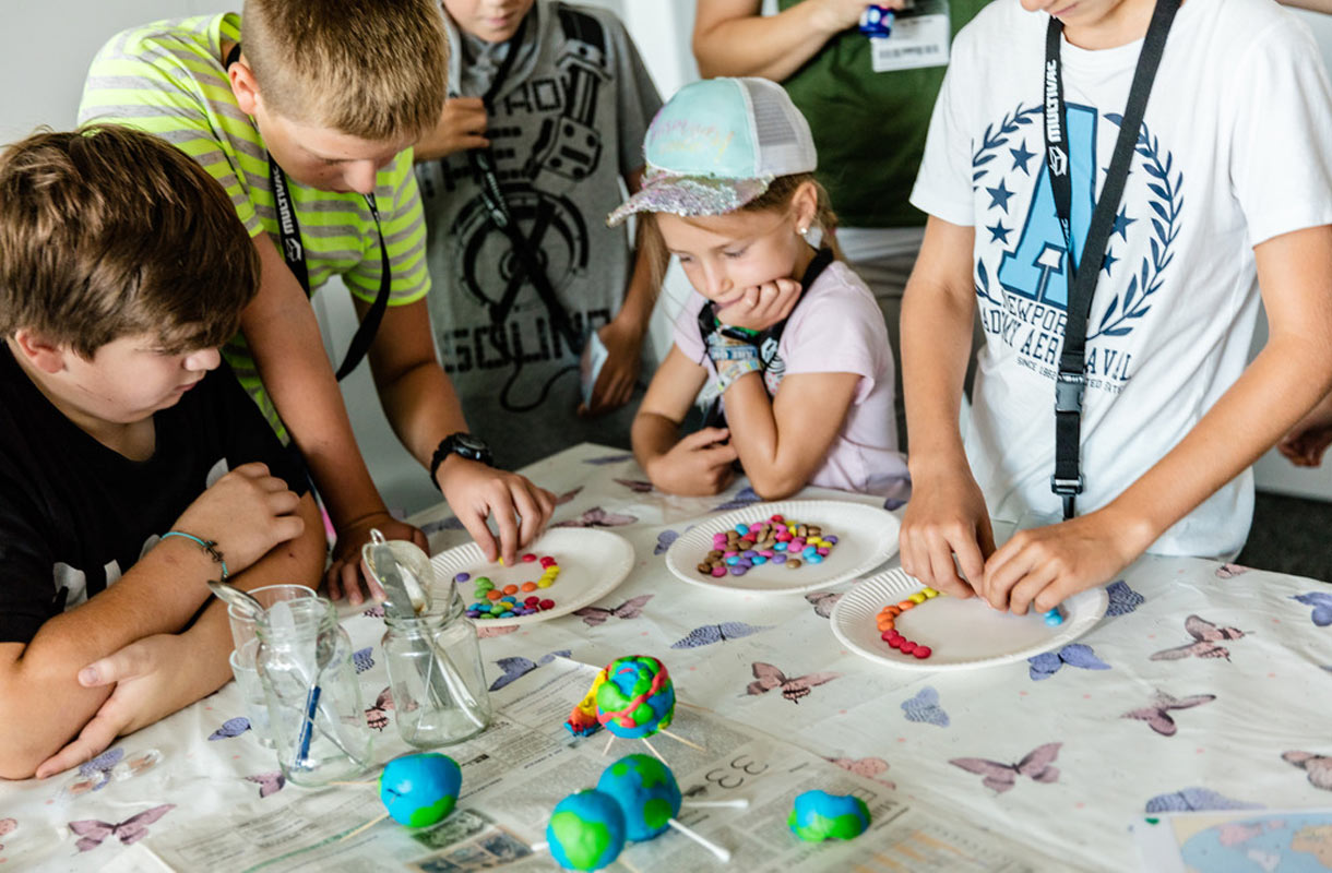 Children Crafting Colorful Beads at Workshop Children Crafting Colorful Beads at Workshop