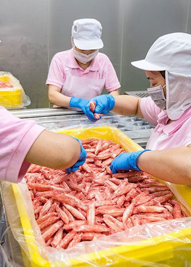 Food Processing Workers Handling Raw Meat