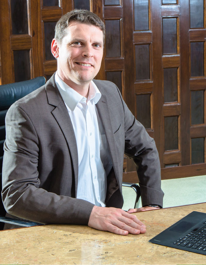 Businessman in Office with Laptop
